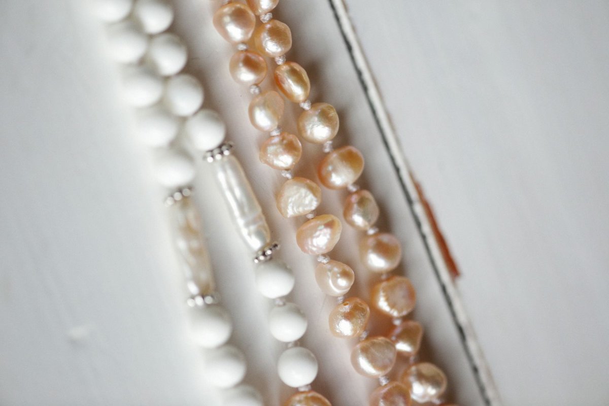 Strands of white and cream pearl beads