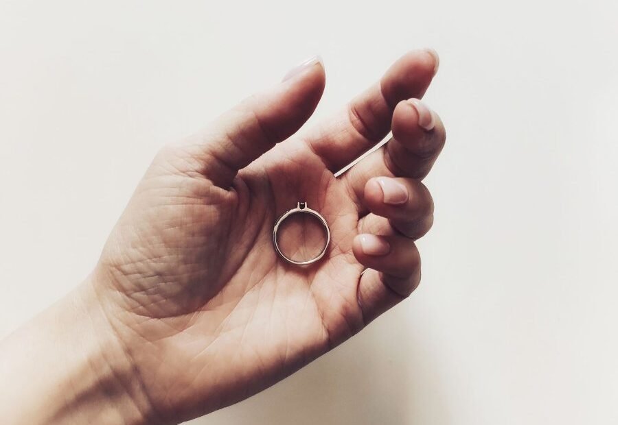 Hand holding a small ring