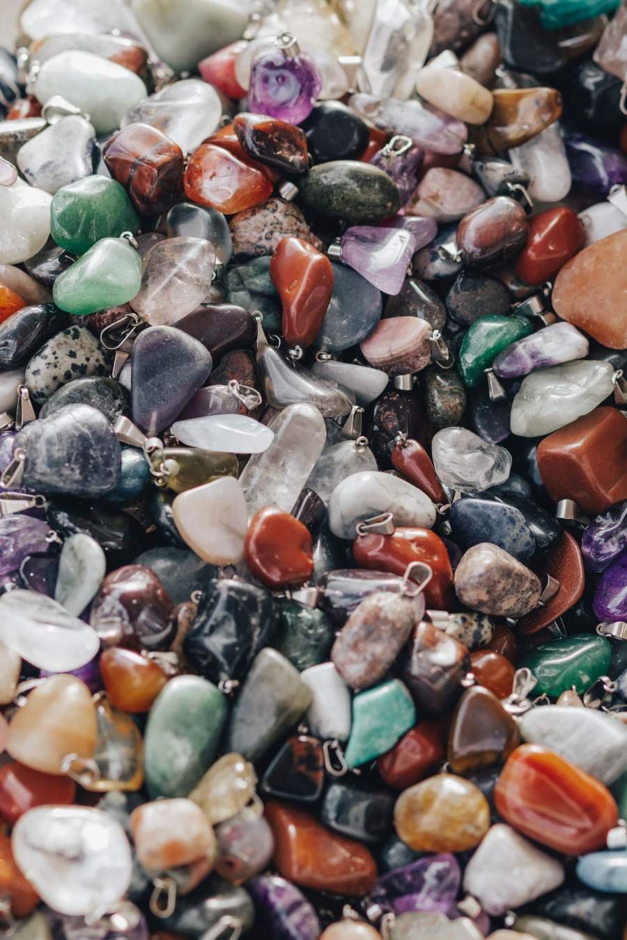Assorted tumbled gemstones in many colors